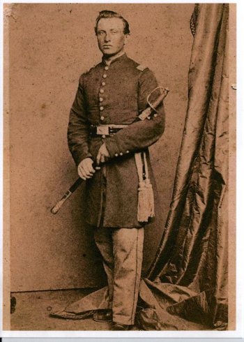 Studio portrait of Lt. Col. David L. Stricker, standing in uniform with sword
